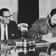 Cuban Prime Minister Fidel Castro signs decree nationalizing all American-owned banks in Cuba, Sept. 17, 1960. President Osvaldo Dorticos, left, who also signed the decree, looks on. Expropriation measure affected First National City Bank of New York, First National Bank of Boston, and the Chase Manhattan Bank.